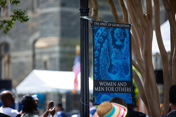 Photo of banner with the words &quot;Women and men for others&quot;